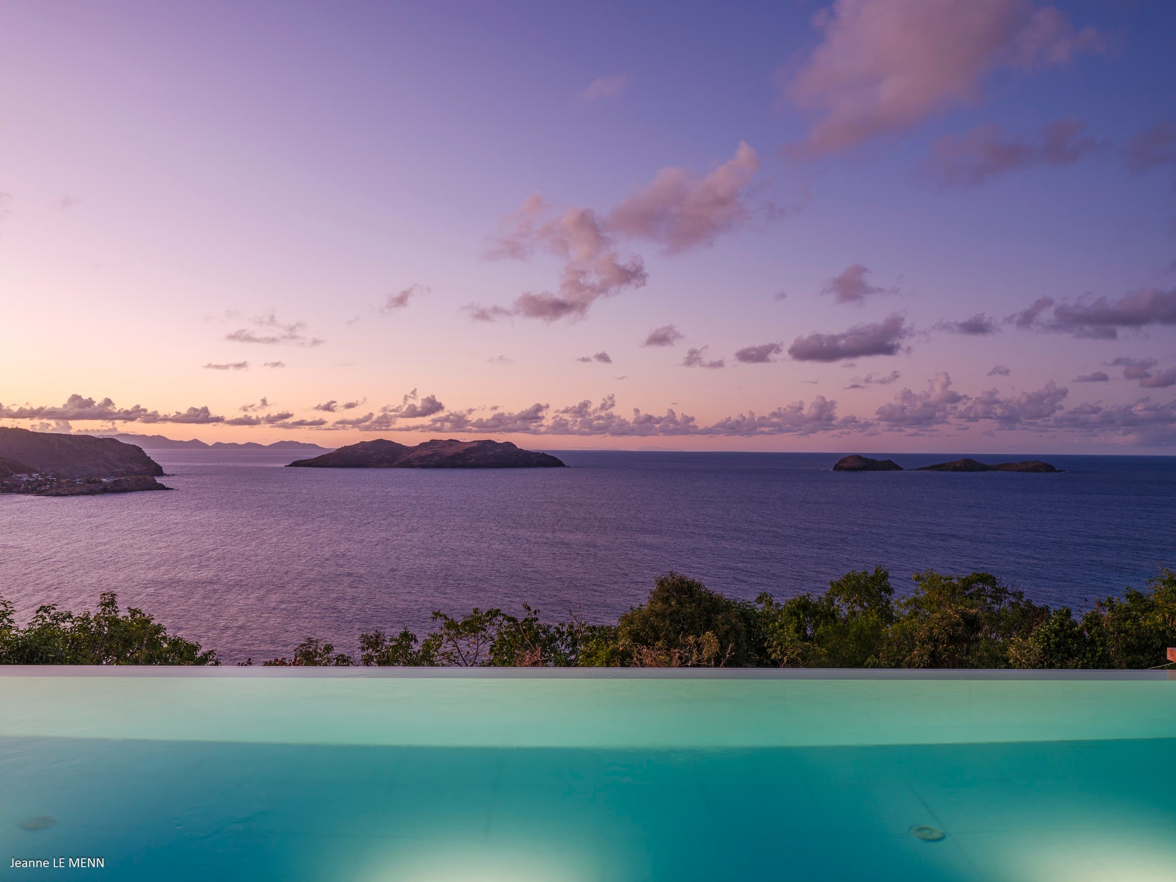 Frigate birds silhouetted against the sunset sky