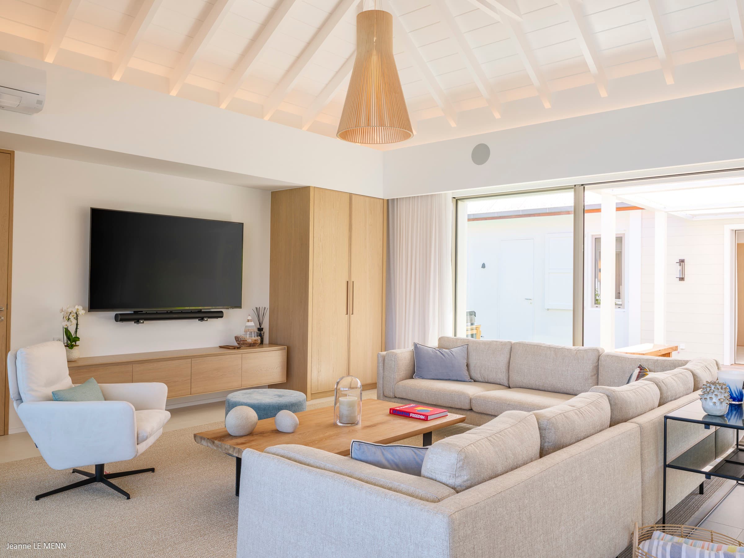 Living room seating area with ocean backdrop