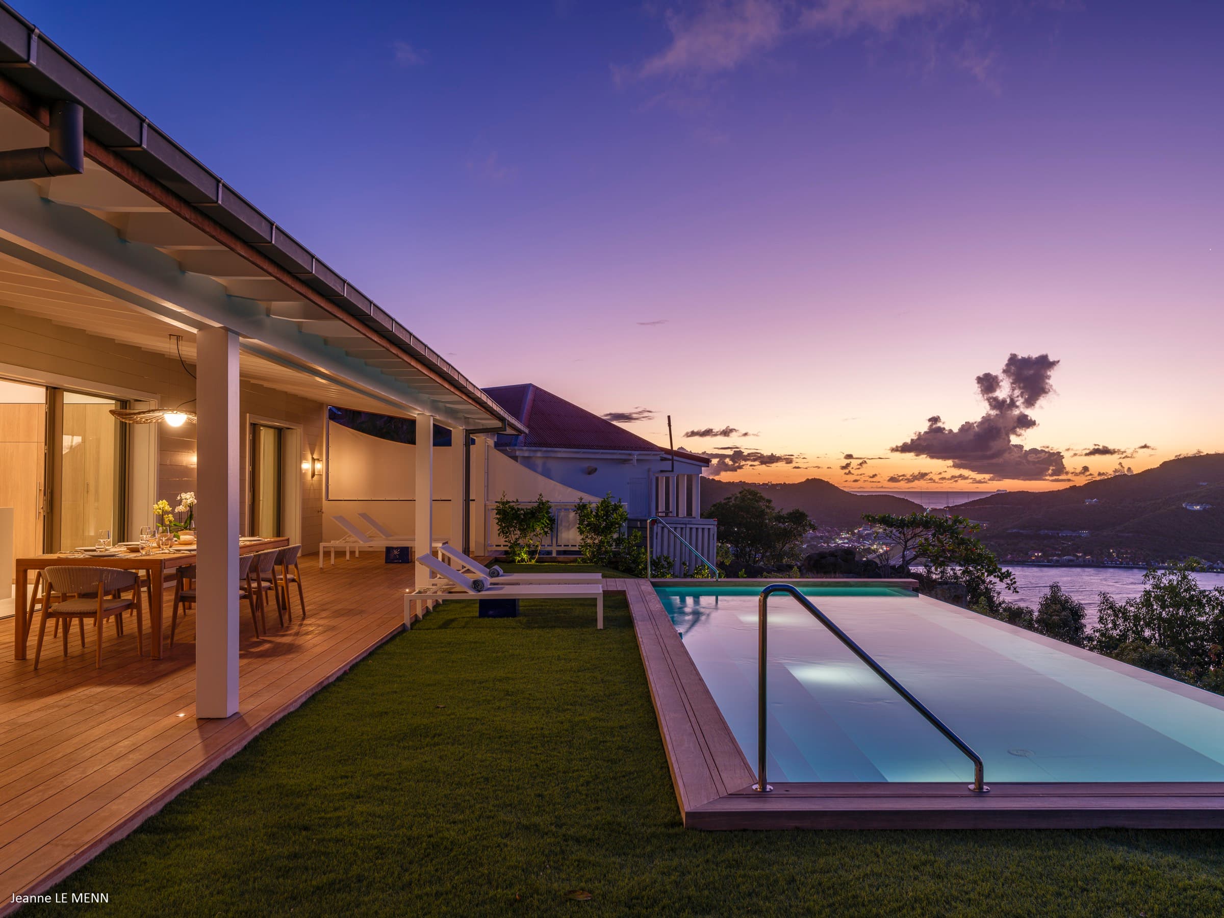 Evening view from the patio with illuminated pool