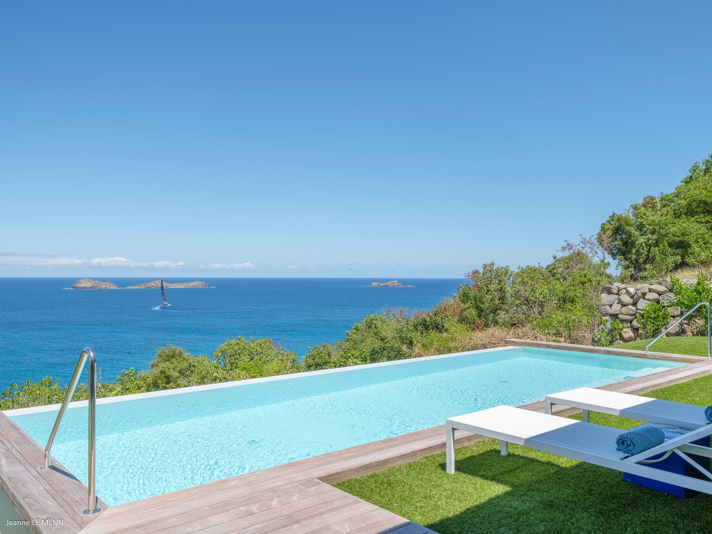 Pool with frigate birds soaring above