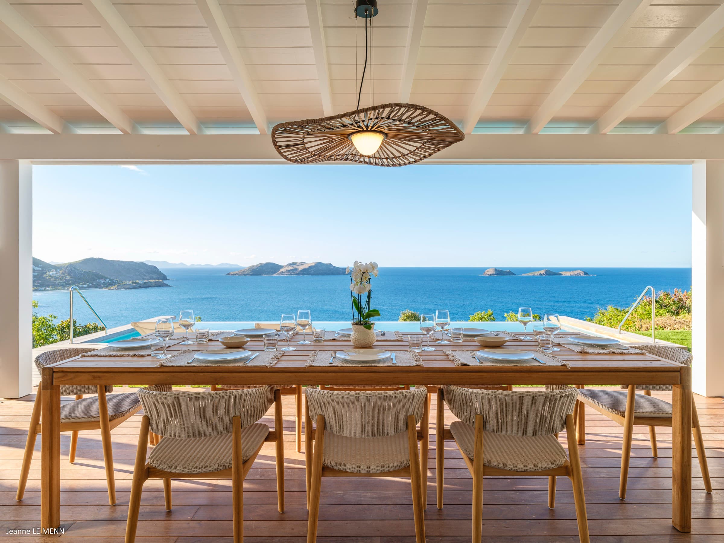 Villa Indigo outdoor dining terrace overlooking the turquoise Caribbean ocean